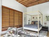 In the couple's guest room, authentic shoji screens have been converted into sliding closet doors. “I have a slight obsession with Japanese precision and culture,” Mel says.