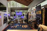 While the home’s amenities feel wholly residential, different rooms are specific to the couple’s various projects. This space is outfitted as an analogue synthesizer studio, where Mel, who is also a film composer, records and edits music.  Photo 15 of 20 in An 11-Year Renovation Helps a Couple Grow Simpatico With the Original Homeowner’s Quirky Vision