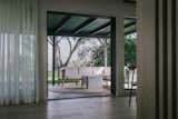 Now, views permeate the entire home. Out on the patio, a sectional sofa from Neighbor and a coffee table from Zachary A. provide a chic gathering space. Hardwood floors from Hallmark run throughout.