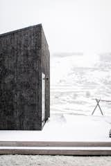 "The placement of the cabin was carefully chosen according to wind and snowfall in the area," the explain the architects. "This way, the entrance is accessible throughout the seasons and in various types of weather—even in heavy snowstorms."