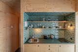 Aska Cabin by Studio Heima kitchenette with emerald-green tiles