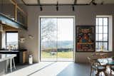 Expansive glass doors between the kitchen and dining area provide direct outdoor access.  Photo 7 of 15 in An Idyllic “Glass Barn” in the English Countryside Asks £2.3M