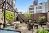 A peek at another outdoor area included with the property. Perched in a pre-war building, the penthouse is a part of a live/work co-op comprised of floor-through loft apartments.