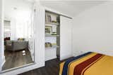 The primary bedroom comes with a custom walk-in closet that reveals a handy desk area.