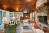 In the living room, recessed lighting is used to emphasize the original wood-clad ceilings.  Photo 3 of 12 in A Dazzling Home by Frank Lloyd Wright’s Final Apprentice Lists for the First Time