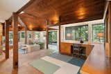 Upon entry, an extensive built-in desk area sits at the edge of the primary living spaces.  Photo 2 of 12 in A Dazzling Home by Frank Lloyd Wright’s Final Apprentice Lists for the First Time