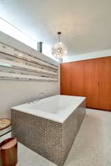 The primary bathroom includes an oversized soaking tub, along with plenty of storage.