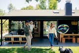 &nbsp;The couple’s back patio and yard are seamless extensions of their indoor living spaces thanks to thoughtful fenestration.&nbsp;