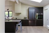 The remodel involved removing a wall in the kitchen to open up the main living spaces. "I typically prefer having individual rooms for certain purposes, but the open plan works well in a midcentury home," says Whitney.&nbsp;&nbsp;