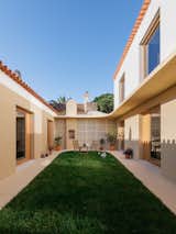 Outdoor, Grass, Hardscapes, and Small Patio, Porch, Deck  Photos from This Dramatic Renovation in Portugal Will Have You on the Edge of Your Seat