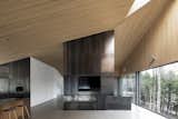 Living Room, Ceiling Lighting, Stools, Concrete Floor, and Two-Sided Fireplace  Search “사설메이저파트너문의 【텔 : XZ114】 죽장 총판 뜻 처음 시작하시는 초보 총판분들도 환영합니다 스포츠총판구합니다 4” from A Cathedral-Esque Lake Home Rises in the Quebec Countryside