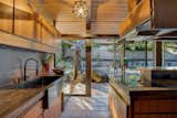 Sliding glass doors create an instant indoor/outdoor connection in the kitchen.