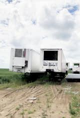 The abandoned semi-trailers sit rusted out prior to renovation.
