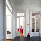 Designers Ezequiel Adelmo Manasseri and María Sol Depetris turned the second floor and attic of a 1906 four-story “French-style” building in Rosario, Argentina, into an apartment that combines historic details with contemporary pieces from their furniture company, Citrino.