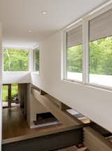 Casement windows that wrap around the double-height living areas capture natural light.&nbsp;