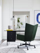 With a stylish chevron back and barely there arms, CB2’s Bowtie caster chair in green bouclé wool is a study in geometry.&nbsp;