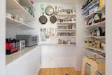 A large pantry sits off the kitchen, offering plenty of storage space.