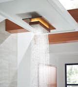 The collection’s&nbsp;Raincan&nbsp;showerhead casts soft LED lighting.
