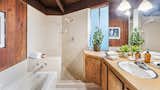 The connected bathroom features an oversized shower and soaking tub.