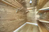 A cedar-clad walk-in closet is also included in the primary suite.