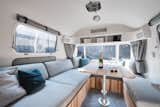 A hydraulic dining table in the saloon can easily be converted into a secondary double bed, which allows the trailer to comfortably accommodate up to four people.