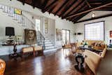 Refinished hardwoods line the floor of the great room, complementing the wood-clad ceiling.  Photo 2 of 14 in A Cozy Spanish-Style Home on Hollywood Boulevard Seeks $2.8M