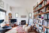 The library is fitted with bohemian flair and features built-in shelving and tiny picture windows.  Photo 8 of 14 in A Cozy Spanish-Style Home on Hollywood Boulevard Seeks $2.8M