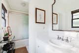 An oversized shower/soaking tub is included in the primary bathroom.  Photo 10 of 14 in A Cozy Spanish-Style Home on Hollywood Boulevard Seeks $2.8M
