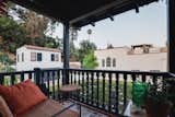 A covered terrace overlooks the fruit trees dotted along the backyard.  Photo 11 of 14 in A Cozy Spanish-Style Home on Hollywood Boulevard Seeks $2.8M
