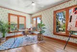 The light-filled office is fitted with a soothing patterned wallpaper from Heath.  Photo 14 of 21 in The Oakland Home Where “Mother” of Mother’s Cookies Once Lived Asks $1.4M