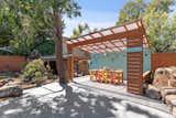 The backyard offers an entertainer's paradise, complete with a covered outdoor dining area.  Photo 20 of 21 in The Oakland Home Where “Mother” of Mother’s Cookies Once Lived Asks $1.4M