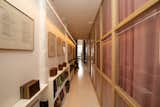 The hallway ensures ample privacy between the public and private wings, while offering plenty of storage to display collected books and memorabilia.