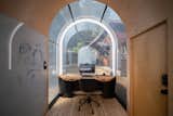 A 10' barrel vault makes the pod feel spacious and airy. The translucent windows can turn opaque at the push of a button.