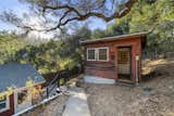 Steps from the main cabin is another turnkey structure—perfect for serving as a detached office.