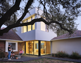 The addition houses a private office, a sitting area, a mud room, and a powder room.  Photo 3 of 9 in This Striking Addition in Austin Is Defined by Clean, Discrete Geometry from Ames House by Matt Fajkus Architecture