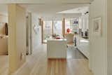 Another view of the kitchen, which also opens onto the side garden. The cabinets are by Conestoga Wood Specialties, and the paint is Decorator’s White by Benjamin Moore.