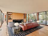 Living, Standard Layout, Sofa, Shelves, Light Hardwood, Chair, Table, and Lamps  Living Lamps Chair Light Hardwood Photos from A 1965 Craig Ellwood Home With an Original Koi Pond Is Restored in Los Angeles