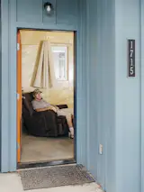 “Jesse really loves his chair. It’s a place where he can look out to the porch through the open door and see all his neighbors go by,” says Corral.
