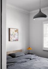 Bedroom, Night Stands, Pendant Lighting, Bed, and Lamps  Photo 11 of 23 in A Multitiered Addition With a Lush Courtyard Revives a Federation-Style Melbourne Home
