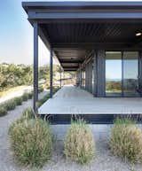 The home is topped with a white roof that deflects heat, keeping temperatures cooler inside.  Photo 9 of 11 in A Prefab in Santa Ynez Provides a Retired Couple With the Perfect California Retreat