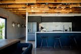 In the kitchen, the backsplash is covered in Cloe ceramic tile from Bedrosians Tile &amp; Stone.  Photo 6 of 12 in A Phoenix Couple Turn a Corner Store Into a Home That Has Everything on Their List