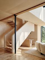 The landing looks out on the dining nook below. Although the couple were required to build on their previous home’s footprint, they were allowed to increase the building’s overall square footage by 25 percent, which brought it to 2,316.