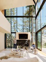 Jørgensen "hardened the structure" with a series of protective layers (including two composed of fire-resistant magnesium board) between the wood frame and the metal cladding. The window-lined living room is the heart of the 2,316-square-foot home.