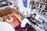 Anna and Thanh kept the already renovated kitchen, which is open to the high-ceilinged living/dining area. Places to display books and artwork, as well as spaces to work and entertain, were all essential for the couple. “This is our first house, and buying property in New York is a serious deal,” says Thanh. “It had to have some things that would, aesthetically and functionally, make it livable for the long term.”