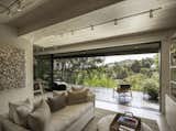 Many of the furnishings are custom-designed to fit the constraints of the square footage. “I was surprised how much I enjoyed working within the limits of a small space,” says Nancy.  Photo 1 of 10 in These Minimalist Prefab Homes Maximize Indoor/Outdoor Living
