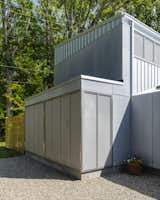 Stainless-steel mesh sits in front of structural insulated panels (SIPs) fixed within the wall panels.