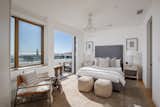 Another bedroom connects to a balcony with pristine ocean views.