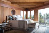 This bedroom also opens to the deck that connects to the open-plan living/dining area.