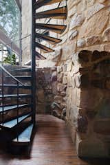 A spiral staircase leads to the home’s second story.