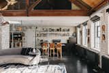 A trove of original charm can be found all throughout the reimagined residence, including glazed tiling, cast-iron radiators, and wide, wooden trusses.  Photo 1 of 9 in A Light-Filled Loft in a Former Bakery Lists for $3.6 Million in London
